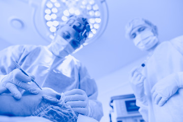 Man surgeon at work in operating room