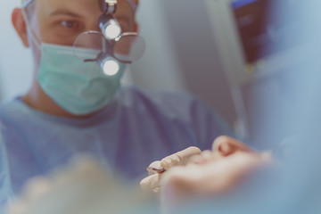 Man surgeon at work in operating room