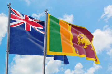 Sri Lanka and Anguilla flags waving in the wind against white cloudy blue sky together. Diplomacy concept, international relations.