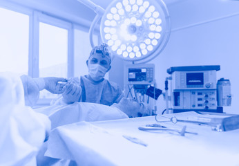 Man surgeon at work in operating room