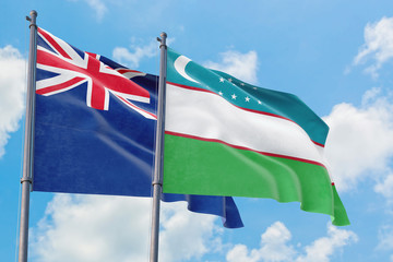 Uzbekistan and Anguilla flags waving in the wind against white cloudy blue sky together. Diplomacy concept, international relations.