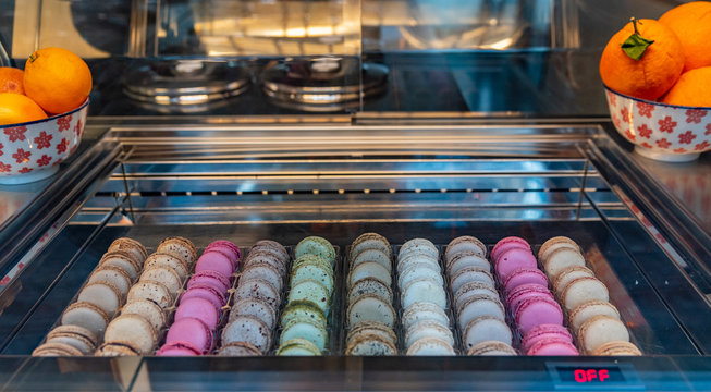 Macarons displayed in a shop window of a pastry shop