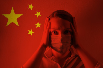 Girl in a mask against the background of the Chinese flag. Coronavirus, danger of disease, new...