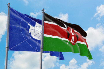Kenya and Antarctica flags waving in the wind against white cloudy blue sky together. Diplomacy concept, international relations.