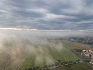 Clouds and fog over the town, Tuscany