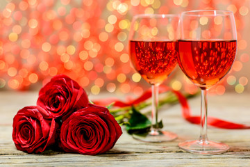 A glasses of wine and roses