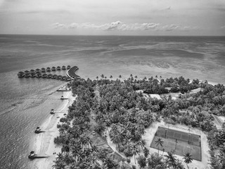 Hotel resort maldiveswith over water bungalow in laccadive sea dream tropical exotic destination in Indian ocean from plane