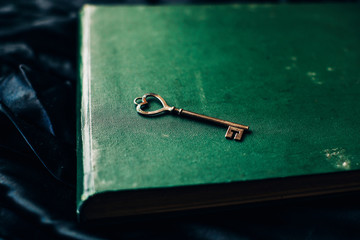 Old key. Key. Book. 