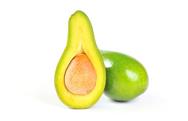 Half sliced avocado and whole isolated on white background.