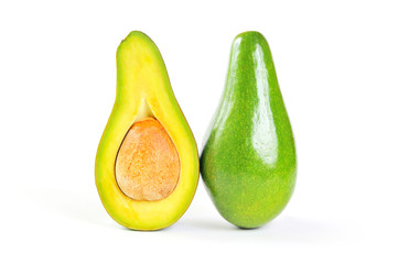 Half sliced avocado and whole isolated on white background.