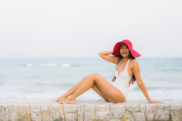 Portrait young asian woman happy smile relax around beach sea ocean