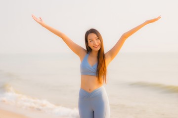 Fototapeta na wymiar Portrait sport young asian woman prepare exercise or run on the beach sea ocean