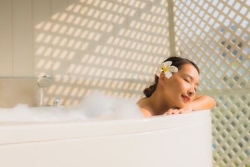 Portrait young asian woman relax take a bath in bathtub