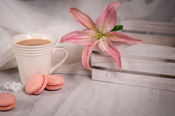 Obraz na płótnie Canvas Cup of Tea or Coffee with Pink Lily Flower and Cookies