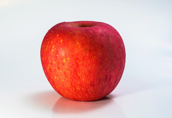 red apple on black background