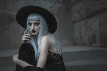 Dark gothic beautiful lady standing outdoor