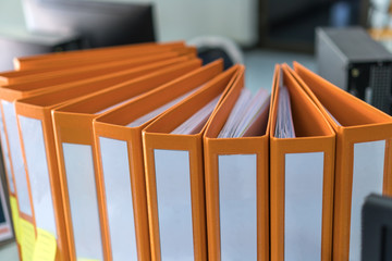 Documents Binder Paper with blank label,Orange Files folder on office desk, Annual Report document for Business papers financial market in offices, lawyer research achieves.Concept work in information