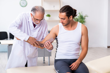 Young male patient visiting experienced doctor