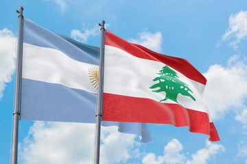 Lebanon and Argentina flags waving in the wind against white cloudy blue sky together. Diplomacy concept, international relations.
