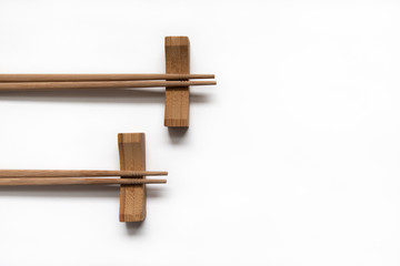 Wooden pairs of chopsticks on white background. cooking culture in Asian countries.