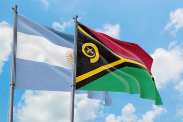 Vanuatu and Argentina flags waving in the wind against white cloudy blue sky together. Diplomacy concept, international relations.
