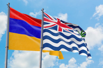 British Indian Ocean Territory and Armenia flags waving in the wind against white cloudy blue sky together. Diplomacy concept, international relations.