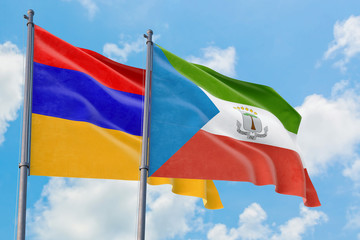 Equatorial Guinea and Armenia flags waving in the wind against white cloudy blue sky together. Diplomacy concept, international relations.