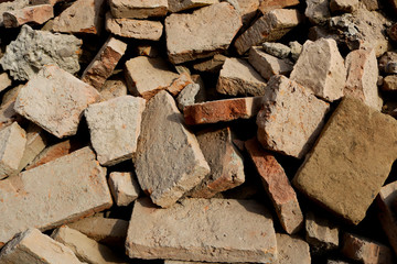 rubble with broken brick pieces from a destroyed wall