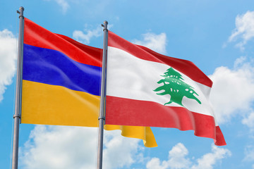 Fototapeta na wymiar Lebanon and Armenia flags waving in the wind against white cloudy blue sky together. Diplomacy concept, international relations.