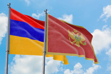 Fototapeta na wymiar Montenegro and Armenia flags waving in the wind against white cloudy blue sky together. Diplomacy concept, international relations.