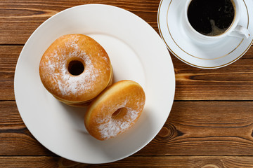 top view donuts with cup of coffee horizontal composition