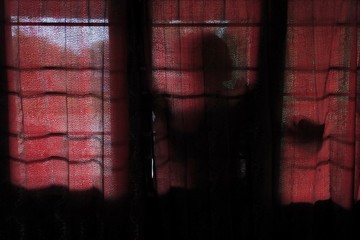 the mysterious silhouette of a woman as an atmosphere of horror