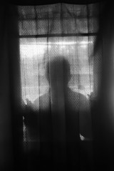 the mysterious silhouette of a woman as an atmosphere of horror