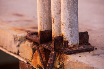 The rusted steel pillars,Rusted with metal rods,Steel pillar in the sea