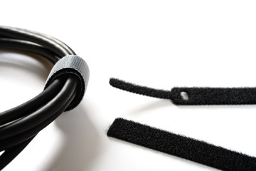 black velcro cable tie and cable on white