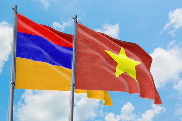 Vietnam and Armenia flags waving in the wind against white cloudy blue sky together. Diplomacy concept, international relations.