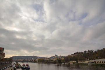 Fototapeta na wymiar Panorama of the Old Town of Prague, Czech Republic, on the Prague Castle (Prazsky hrad) seen from the Vltava river. The castle is the main touristic landmark of the city