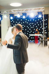 Beautiful wedding couple just married and dancing their first dance