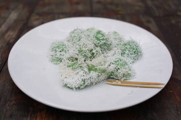 Klepon or Kelepon is a typical Indonesian snacks that come from Java. food made from glutinous rice flour which is formed by small balls plus brown sugar in it and sprinkled with grated coconut