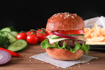 Hamburger with beef cutlet and vegetables