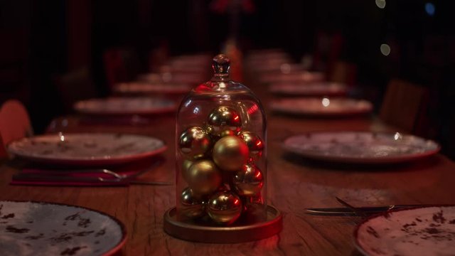 Christmas decoration on table, tree balls in glass cover, shallow depth of field