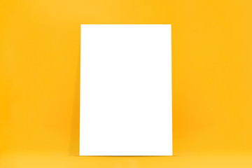 Fototapeta premium Empty white billboard on yellow background