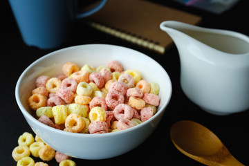 Cereal flakes in bowl with copy space,Breakfast concept.Food with delicious fruity taste and fruity colours.It's made with maize,wheat,and barley