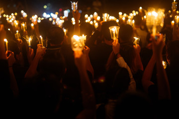 Fototapeta na wymiar People hand holding candle for pray