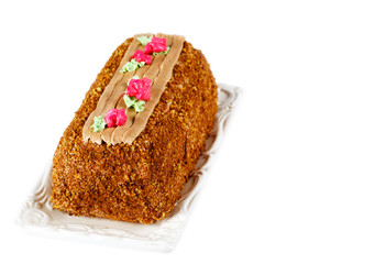 Roulade cake decorated with colourful buttercream flowers. Yule Log Cake. Cake Skazka.