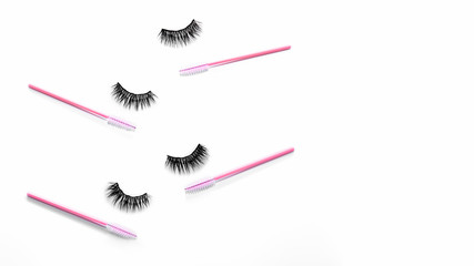 Magnetic fake artificial black eyelashes with mascara pink brushes isolated on white background. Eyelash extension cosmetology tool concept, beauty treatment, improving physical appearance. Copy space