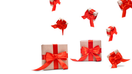 Flying craft paper gift boxes with red ribbon bow levitation isolated on white backdrop. Valentine's day. 8 March, International Happy Women's Day, birthday greeting card.  Festive banner. Copy space