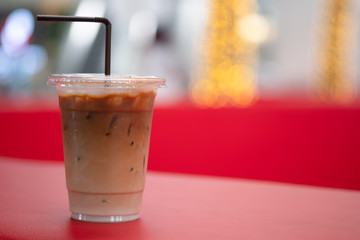 Iced latte coffee in plastic cup