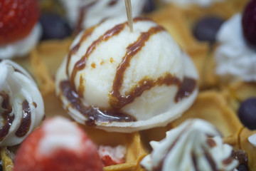 Belgian baked waffle with cream and caramel topping or sauce