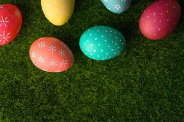 easter eggs on grass flat lay, easter composition. with space on grass.